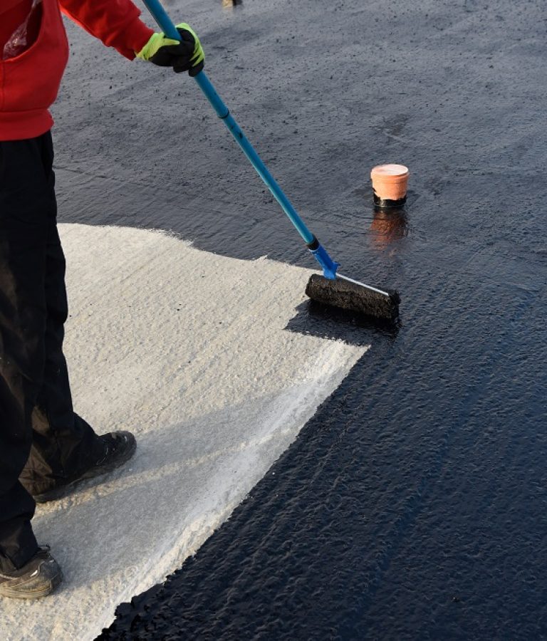 Waterproofing,Coating.,Worker,Applies,Bitumen,Mastic,On,The,Foundation.,Roofer